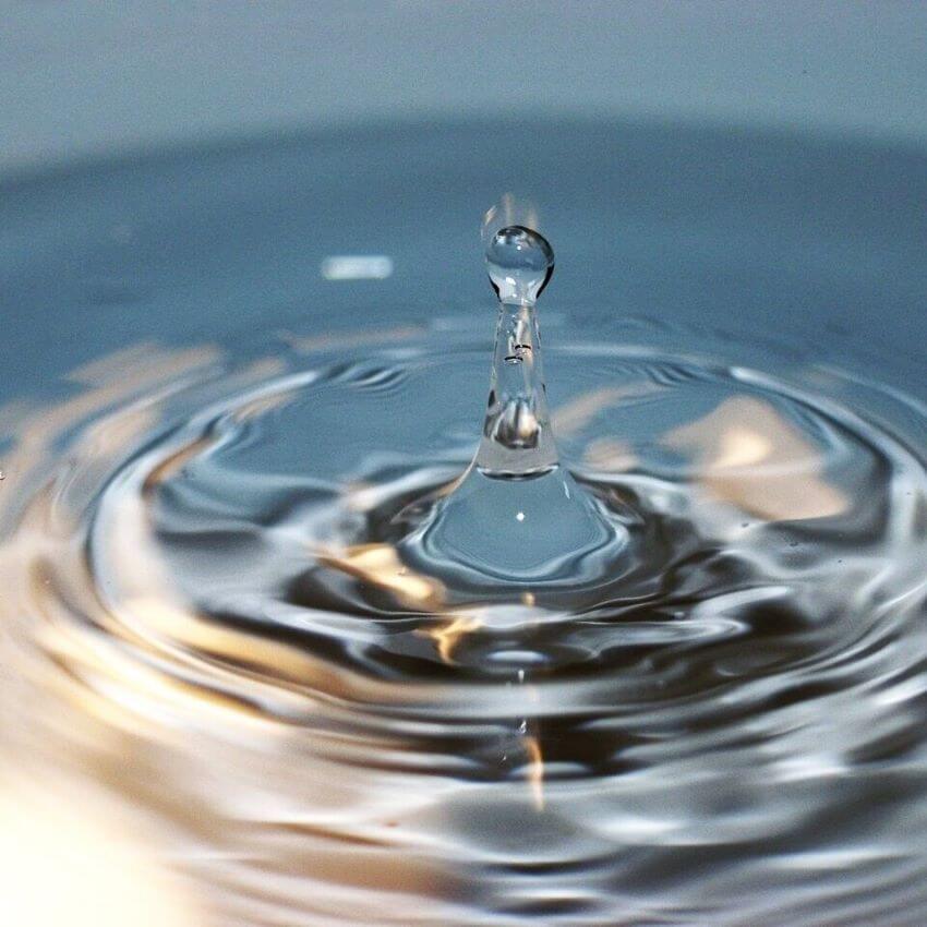 Blue water with drops falling for blog: HYALURONIC ACID: THE SECRET TO GLOWING SKIN