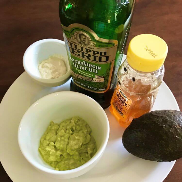 Mashed avocado, yogurt, honey, olive oil on plate for blog: DIY RECIPES FOR GORGEOUS HANDS