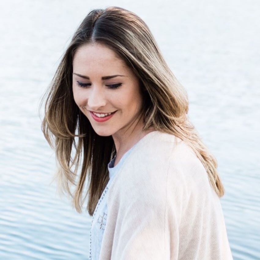 Picture of woman thinking at lake for blog: H. HONEYCUP DONATES SELF CARE SETS TO CARON TREATMENT CENTER