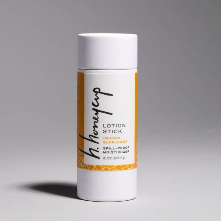 Image of H. Honeycup natural orange lotion stick for blog describing how a lotion stick is applied to the body.