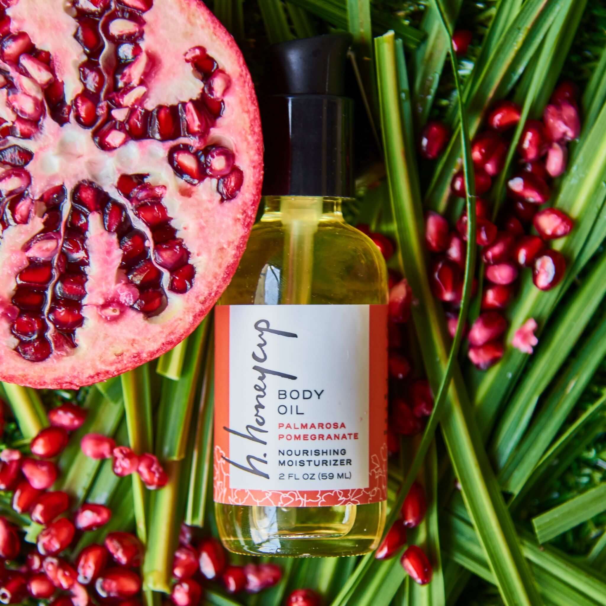 Body Oil Collection featuring Palmarosa Pomegranate body oil with fresh pomegranates