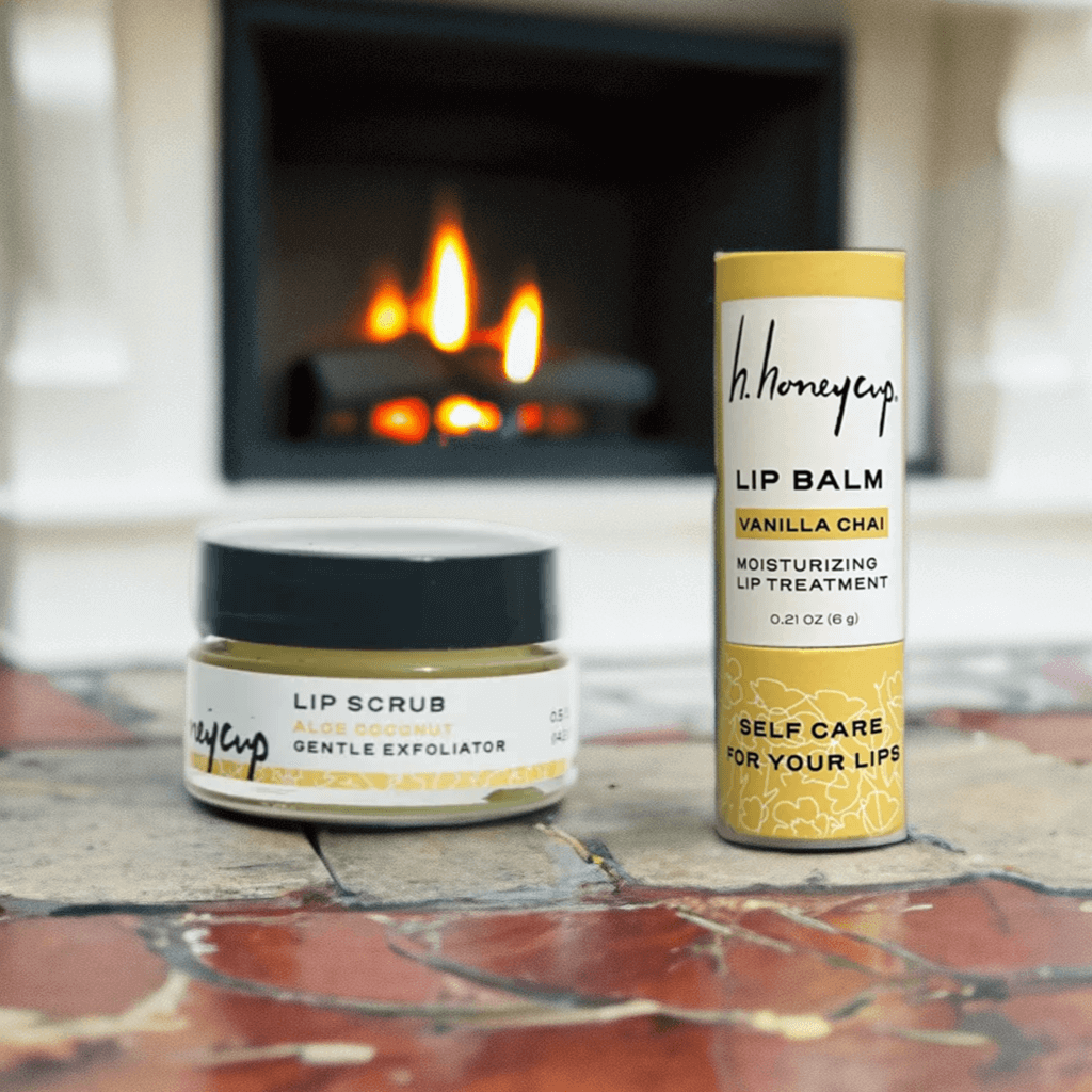 2 piece lip care set in front of a fireplace to suggest a winter skin care treatment
