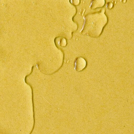 Body oil texture shown on yellow background