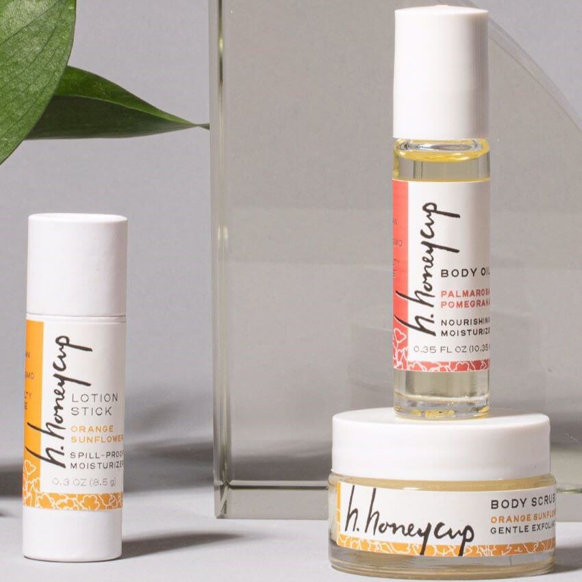 Mini scrub, oil, stick arranged at different levels for blog: ANNOUNCING TAKE CARE GIFT BUNDLE BY H. HONEYCUP