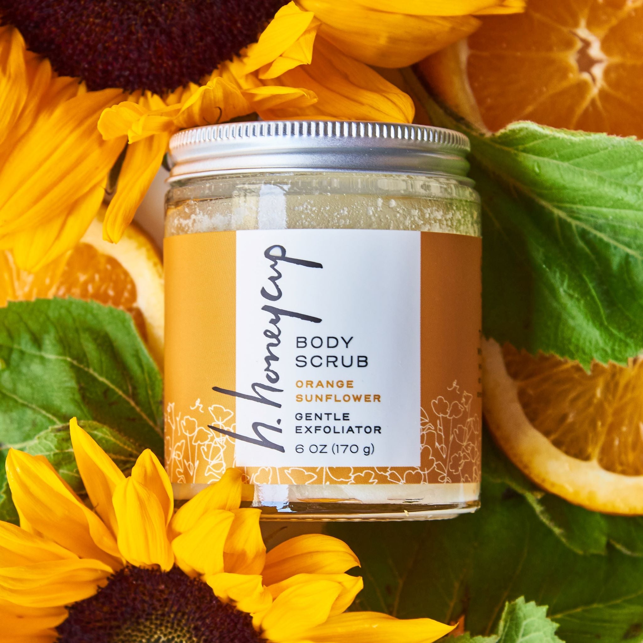 sugar scrub with oranges and sunflowers